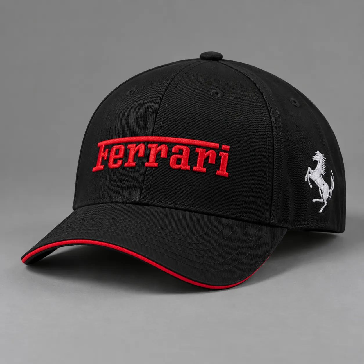 Black cap with red Ferrari embroidery and red trim, product shot